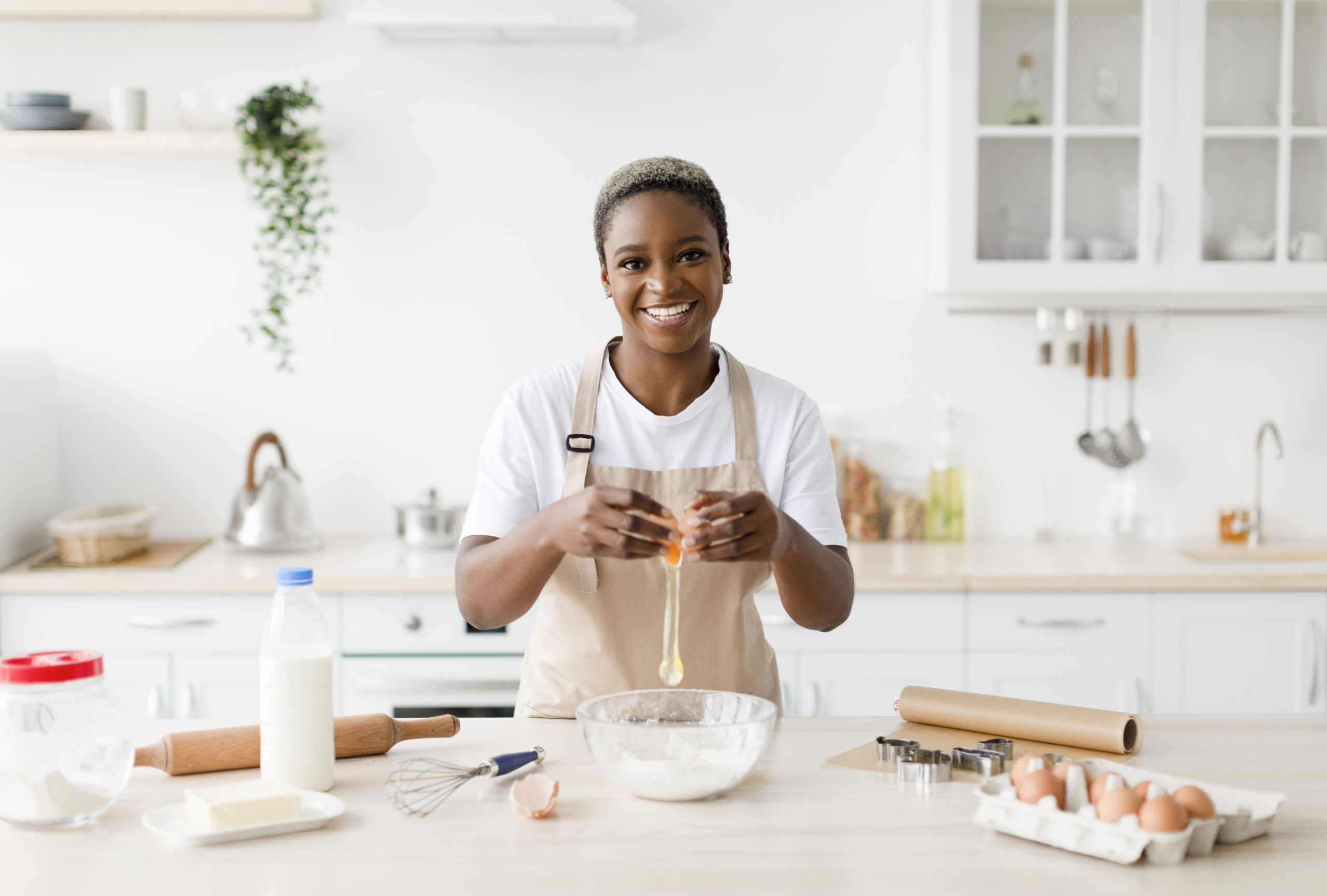 cheerful young pretty black female in apron breaks 2