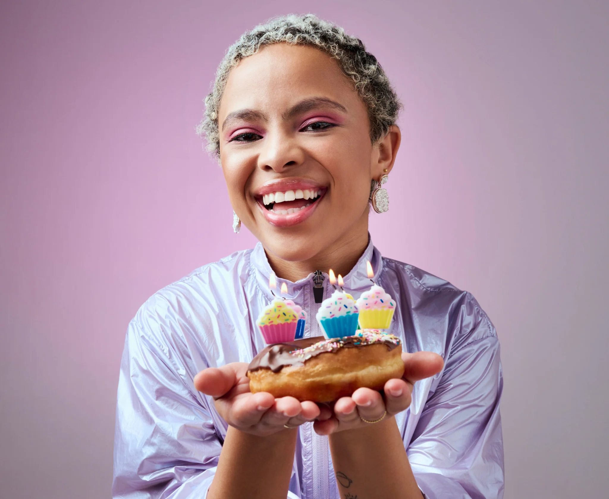Birthday cake, party and a black woman on pink background.